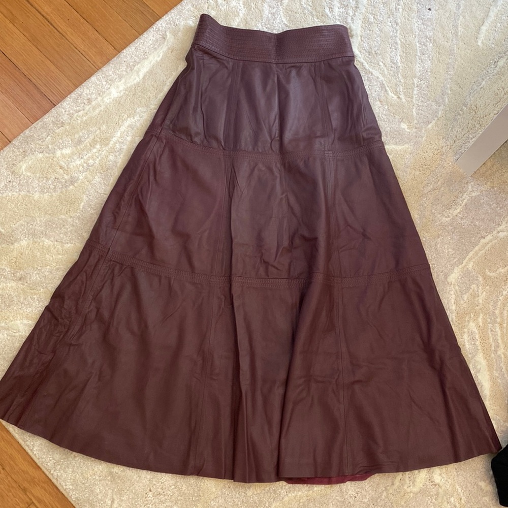 Olivia Palermo maroon leather long skirt
